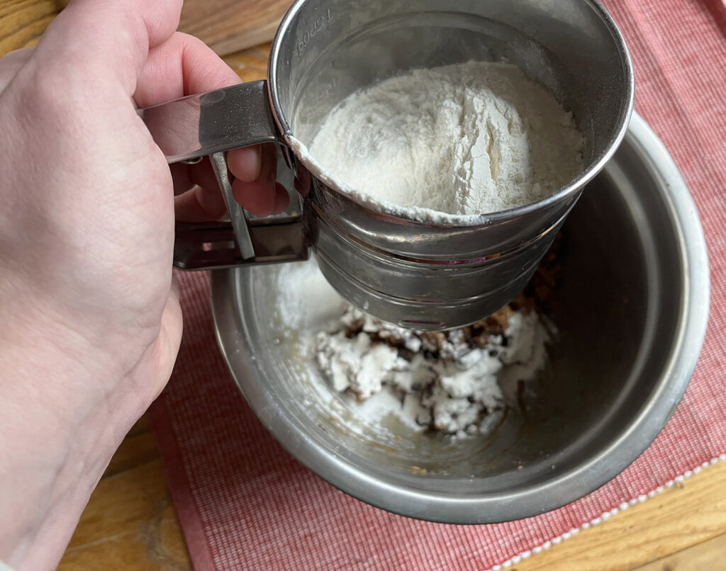 Sifting flour for the best chocolate chip cookie recipe