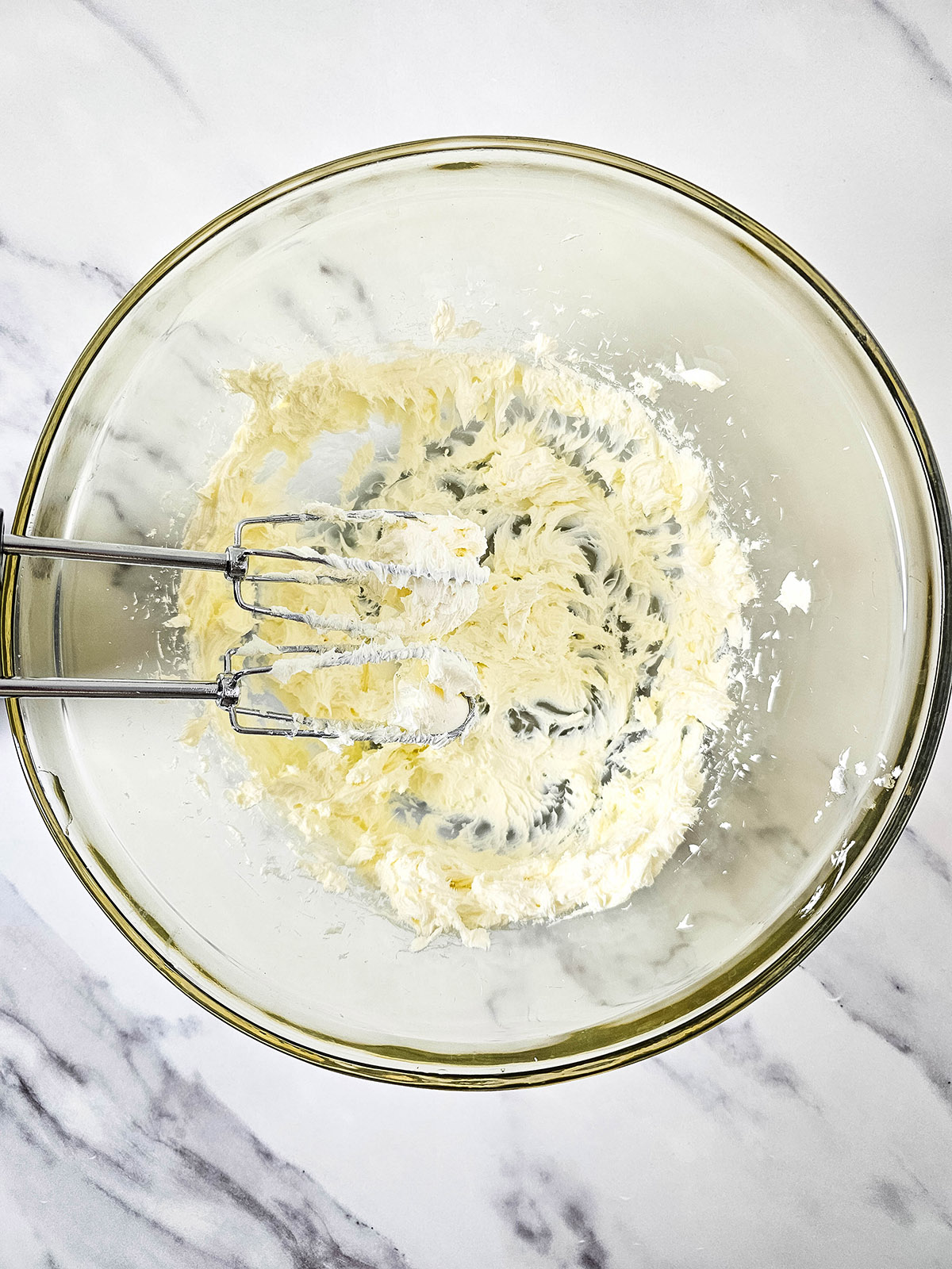 Beat the cream cheese in a bowl until light and fluffy