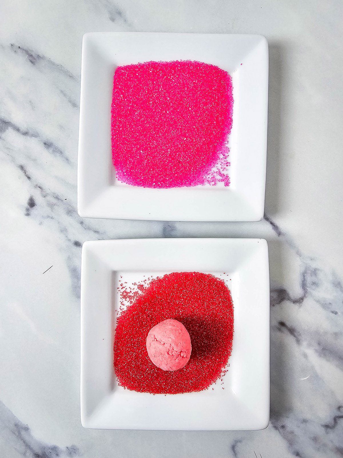 Roll the strawberry truffle balls in the sanding sugar