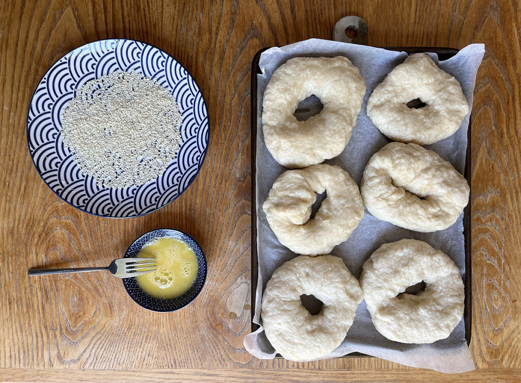 Lightly whisk egg and brush the bagel with it
