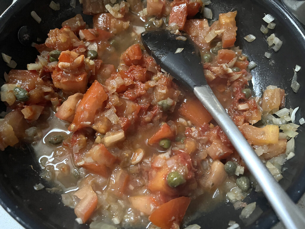 Give this olive free pasta puttanesca recipe a good cup of starchy pasta water!