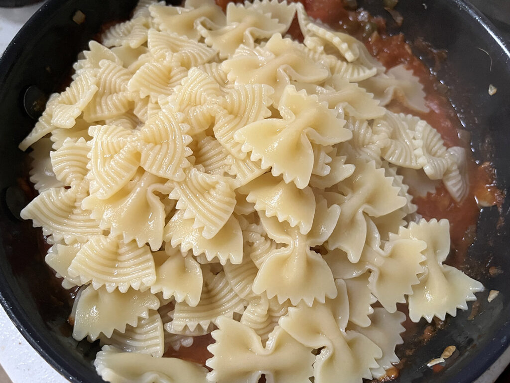Add the pasta to the puttanesca sauce
